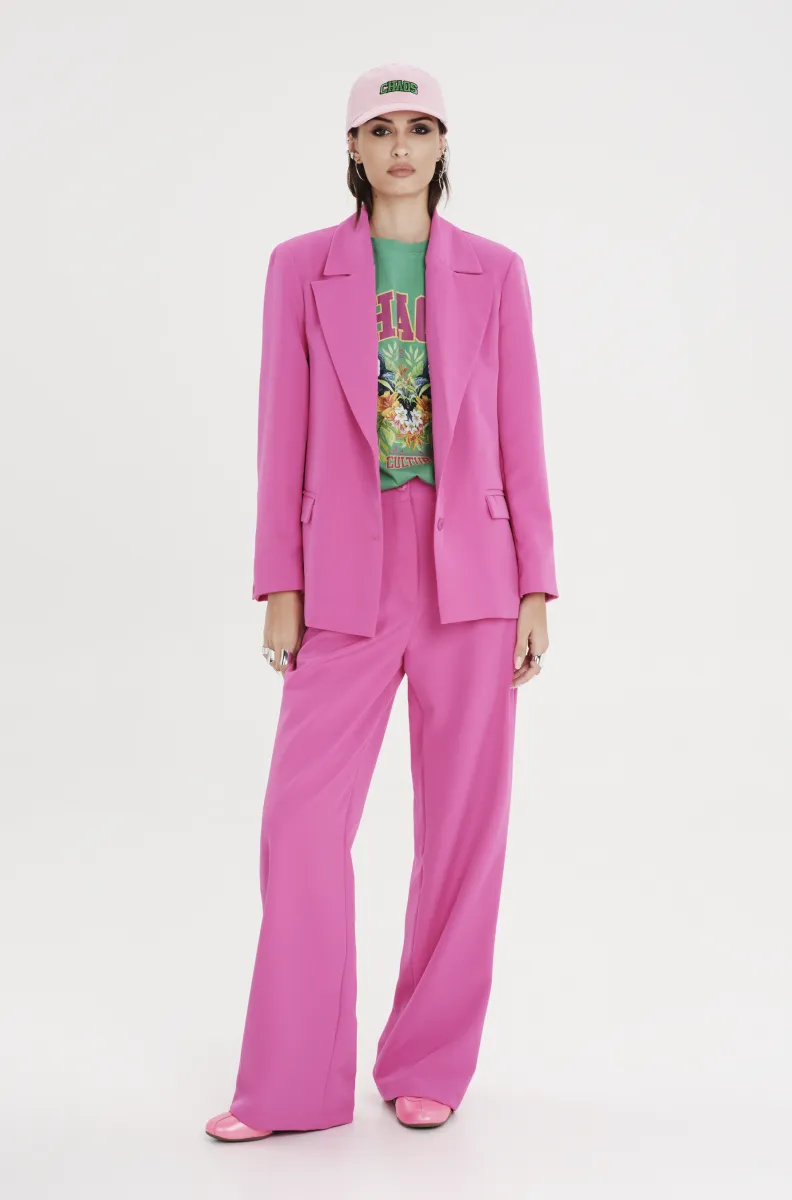 Παντελόνι από την εταιρία Peace and Chaos σε φούξια χρώμα.