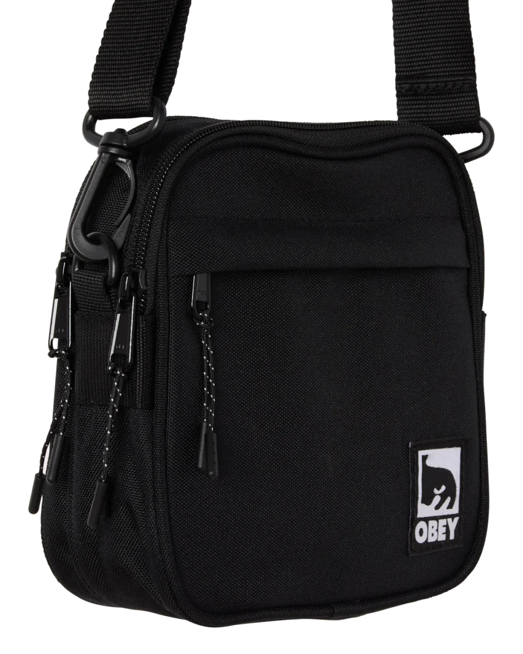 Η OBEY Half Eye Crossbody Bag συνδυάζει λειτουργικότητα και χαρακτηριστικό streetwear design.