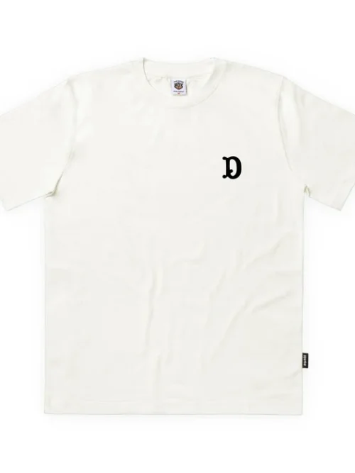 Premium ανδρικό κοντομάνικο T-shirt The Dudes Big D σε off-white χρώμα, με χαρακτηριστικό artwork Big D του καλλιτέχνη McBess.