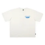 Premium ανδρικό κοντομάνικο oversized heavyweight T-shirt της The Dudes, σε off-white χρώμα, με το χαρακτηριστικό Fucky Weekly artwork του καλλιτέχνη McBess.