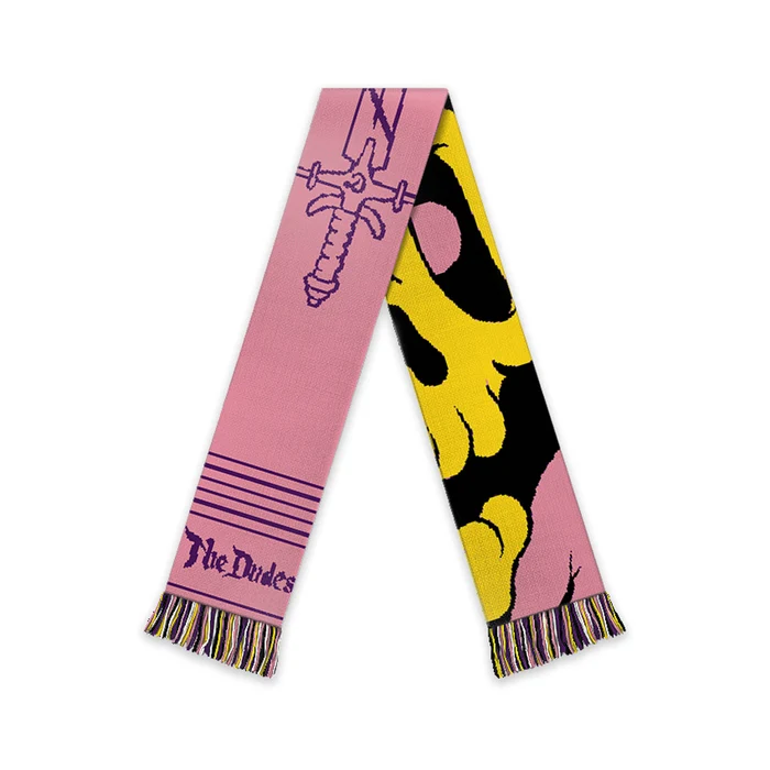 Το Fan Scarf είναι ένα πολύχρωμο κασκόλ με το χαρακτηριστικό Fan artwork του γνωστού καλλιτέχνη McBess. Ένα ξεχωριστό streetwear αξεσουάρ που συνδυάζει έντονη αισθητική, άνεση και πρακτικότητα.